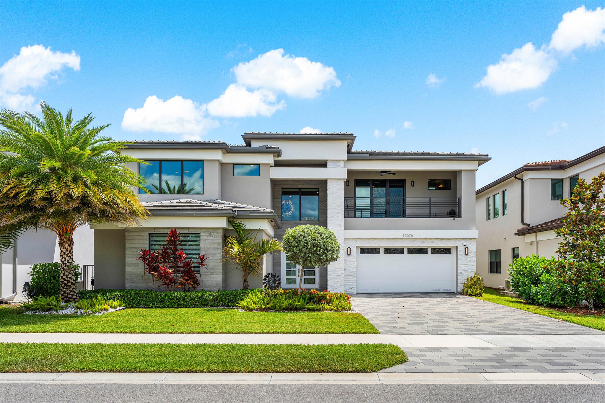 Experience luxury living in the sought-after Lotus community in Boca Raton. This stunning lakefront Sumatra model features over $400K in upgrades, 5 ensuite bedrooms (including a first-floor primary suite), a custom office, and a media room. The chef's kitchen boasts Miele appliances, a 48'' flush fridge/freezer, and sleek cooktop. Enjoy smart home features, whole-house generator, water filtration, custom closets, electric shades, contemporary lighting throughout and so much more. The private backyard oasis offers turf, a putting green, lush landscaping, and a covered lanai with phantom screens. Resort-style amenities include a clubhouse, restaurant, fitness center, sports complex, tennis, and pickleball. Seller offering a closing credit toward buyer's closing costs based on purchase price