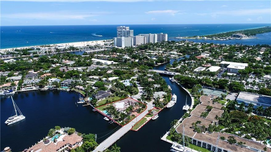 This spectacular walled & gated estate is a boater's dream ~ Over 400' of deep water frontage, quick & easy ocean access & dockage for 2 mega yachts! Gourmet kitchen, full service bar, lavish master suite w/expansive closets, theater & elevator. Swim-up pool bar & spa, 4 car garage. Lush landscaping. Tranquil lake views, prestigious Harbor Beach location, close to air & sea ports, fine dining, shopping & major highways. Private beach club & marina available.