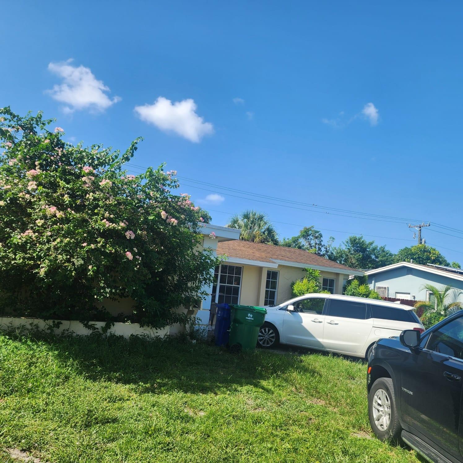 Amazing single house in the area of Miramar area with a 3 bedroom and 2 bath that can convert to 4 bedrooms. Split floor design with master bedroom on one side and two other bedrooms on the other side. Beautiful brand-new kitchen with electric stove and microwave. Kitchen can hold dining room. There is a Florida room where people can relax and enjoy a huge garden view in the backyard, including several trees likes mangos and other native plants. In the backyard, there is a nice storage room (10X10) that is well secured. The front has gorgeous landscaping with a variety of trees.