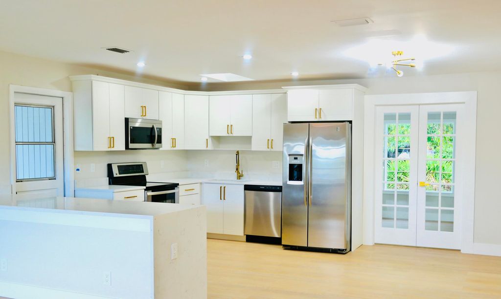 Photo of 551 Palmetto Drive, Lake Park, FL 33403 (MLS # R11167614)