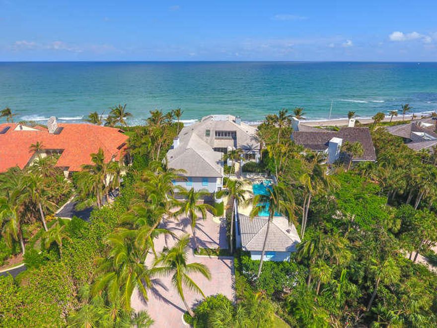 This spectacular, direct oceanfront estate is nestled on the quiet cul-de-sac of East End. Situated on 1.3 acres of lush grounds, the home features 6 bedrooms with ensuite baths, 3 half-baths and a poolside cabana. The residence is a coastal oasis offering serene ocean views from the main living areas and master bedroom. With more than 13,000 total square feet, private setting and pristine beach, this home is an exceptional example of Lost Tree Living.