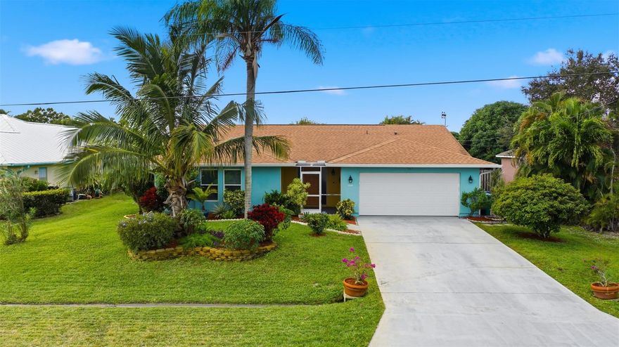 Experience refined living in this beautifully maintained Sandpiper Bay 3/2/2 pool home, freshly painted inside and enhanced with 24-hour camera surveillance and ADT security. This bright split floor plan offers a spacious living area with pocket sliders leading to your own private oasis—an inviting heated saltwater pool surrounded by tropical landscaping and fruit trees. The updated kitchen features granite countertops, stainless steel appliances, and a new washer and dryer. The primary suite includes a walk-in California Closet, while guest bedrooms showcase new tile flooring and a convenient pool-access bath. Major upgrades include Roof 2022, WH 2022, AC 2021, Pool Heater 2020, Bahama Shutters 2019, and Partial Hurricane Windows 2019. Minutes to Jensen Beach and historic downtown Stuart.