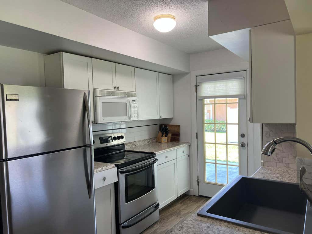 Photo of 432 SW Curry Street, Port Saint Lucie, FL 34983 (MLS # B26044482)
