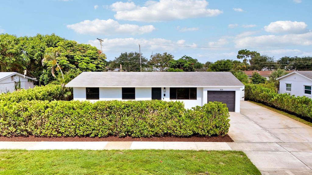 Photo of 816 Juniper Drive, North Palm Beach, FL 33408 (MLS # B26044627)