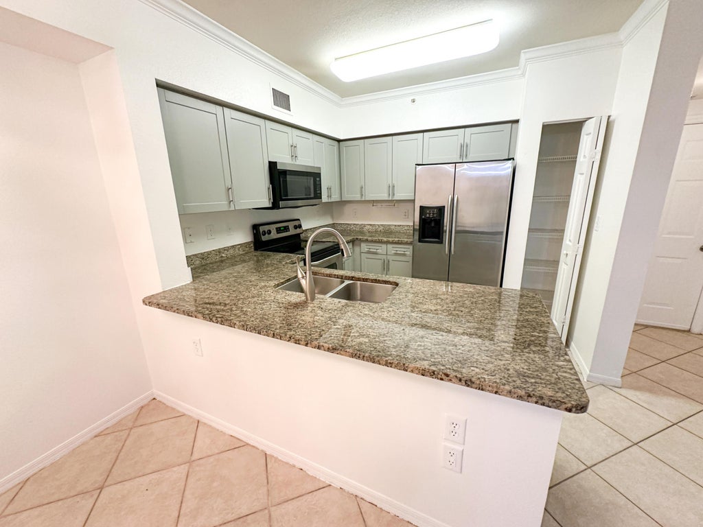 Photo of 6434 Emerald Dunes Drive #203, West Palm Beach, FL 33411 (MLS # R11016772)