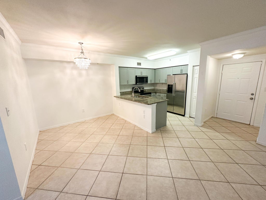 Photo of 6434 Emerald Dunes Drive #203, West Palm Beach, FL 33411 (MLS # R11016772)