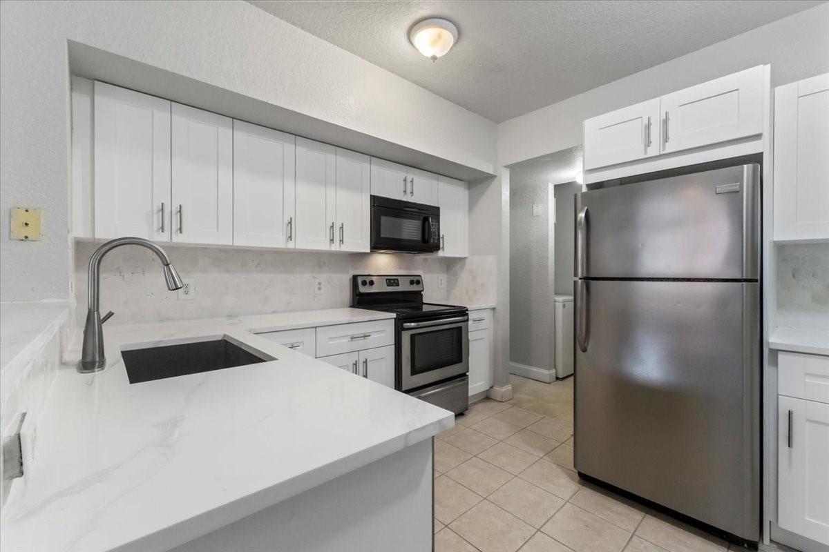 Gated community offering luxury, convenience, and investment potential!  This 2 bedroom, 2 bathroom condo features an open-concept layout and spacious living areas with WASHER & DRYER IN UNIT. Enjoy resort-style amenities, including a community pool, fitness center, and clubhouse. Located just minutes from shopping, dining, and entertainment, this investor-friendly community allows immediate rentals—perfect for generating income or making it your dream home! FULL RESERVES & NO ASSESSMENTS. Don’t miss this incredible opportunity—schedule your showing today.