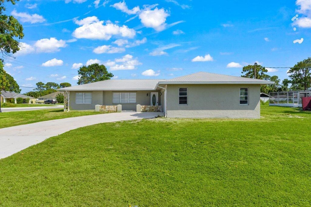 Photo of 798 SE Atlantus Avenue, Port Saint Lucie, FL 34983 (MLS # R11095714)