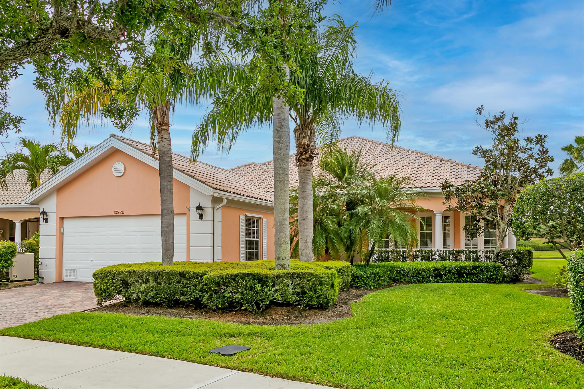 Enjoy MAGNIFICANT LONG LAKE views from your private pool & screend lanai in this desirable Di Vosta built ''Carlyle'' floor plan. Noted for it's charming ''front porch'', bright & cheerful living & dining room PLUS family room make this home a family favorite. Additional features include tasteful living room fireplace, crown molding, chair rails & custom trimwork through out every room and built in wall features in the family room.Retreat to your private lanai with retractable shade, heated pool and spa. The back yard long lake views are amazing. The Lakes offers full clubhouse amenities, 2 heated pools, fitness center, tennis, pickelball, 24 hr manned gate & walking distance to Tradition shops, park & restaurants. Bring your personal taste to update this beauty & make it your own!
