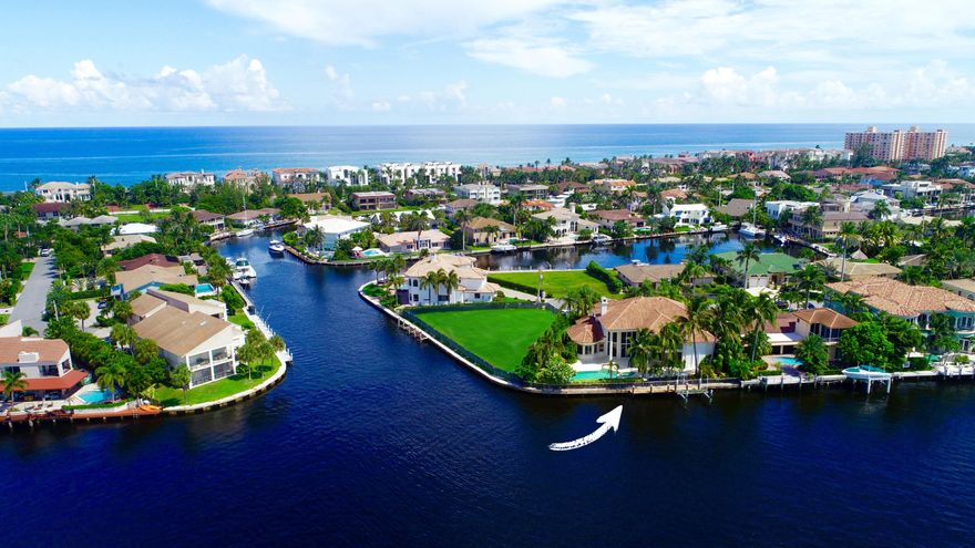 Sweeping panoramic views from this fabulous luxury waterfront residence in a one of a kind setting on 130' of Direct Intracoastal, this home has it all.  Uniquely nestled in Bel Lido, a private and quiet enclave close to pristine beaches with deeded beach access, this luxury home was recently renovated with extraordinary quality and style and boasts over 4,775 square feet of living area with 4BR and 5 plus baths. The ground floor features a spacious open living plan; a living room with floor to ceiling windows, formal dining room, custom coral fireplace, over size gourmet kitchen, two dishwashers and casual family room for cozy gatherings, all providing expansive views of the waterfront background. In addition, the home abounds with sumptuous walnut, cherry and mahogany woodwork, elevator,