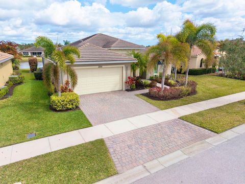 Photo of 11555 SW Apple Blossom Trail, Port Saint Lucie, FL 34987 (MLS # B26017572)
