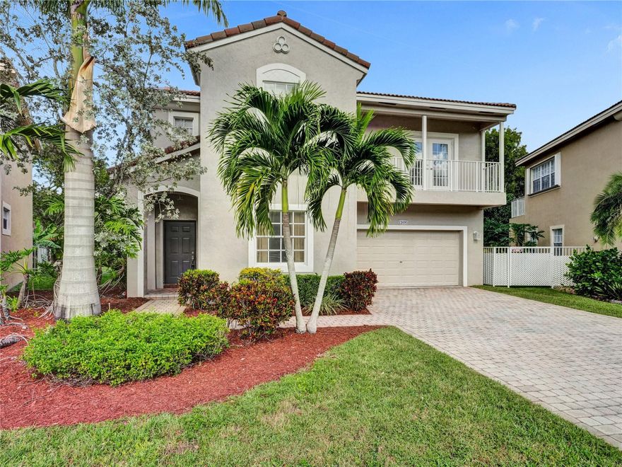 Beautiful WATERFRONT home with 4 bedroom, 3 full bathrooms + HUGE BONUS in the desirable gated community of Vizcaya! One of the largest lots in the neighborhood overlooking a canal, enjoy your private spacious backyard & water view from your covered screened-in lanai & balcony. 1 bedroom and full bath downstairs. Upstairs you'll find the Master and 2 other bedrooms + the bonus room that can be used as a family room/playroom or convert to 5th bedroom. RENOVATED KITCHEN with white wood cabinets, Stainless Steel appliances and beautiful Granite countertops, tile floors downstairs & wood laminate floors on stairs and upstairs (NO CARPET!), updated master bathroom, NEW AC and water heater. LOW HOA INCLUDES LANDSCAPING, CABLE, ALARM & AMENITIES: pool, hot tub, gym + tennis