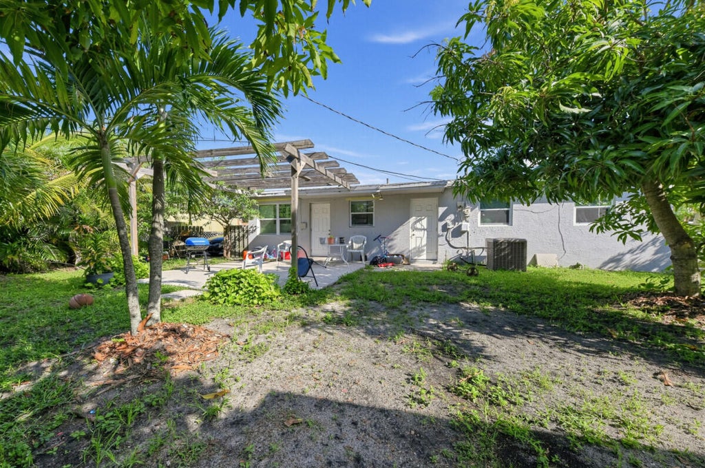 Photo of 1209 W 26th Court, West Palm Beach, FL 33404 (MLS # B26080626)