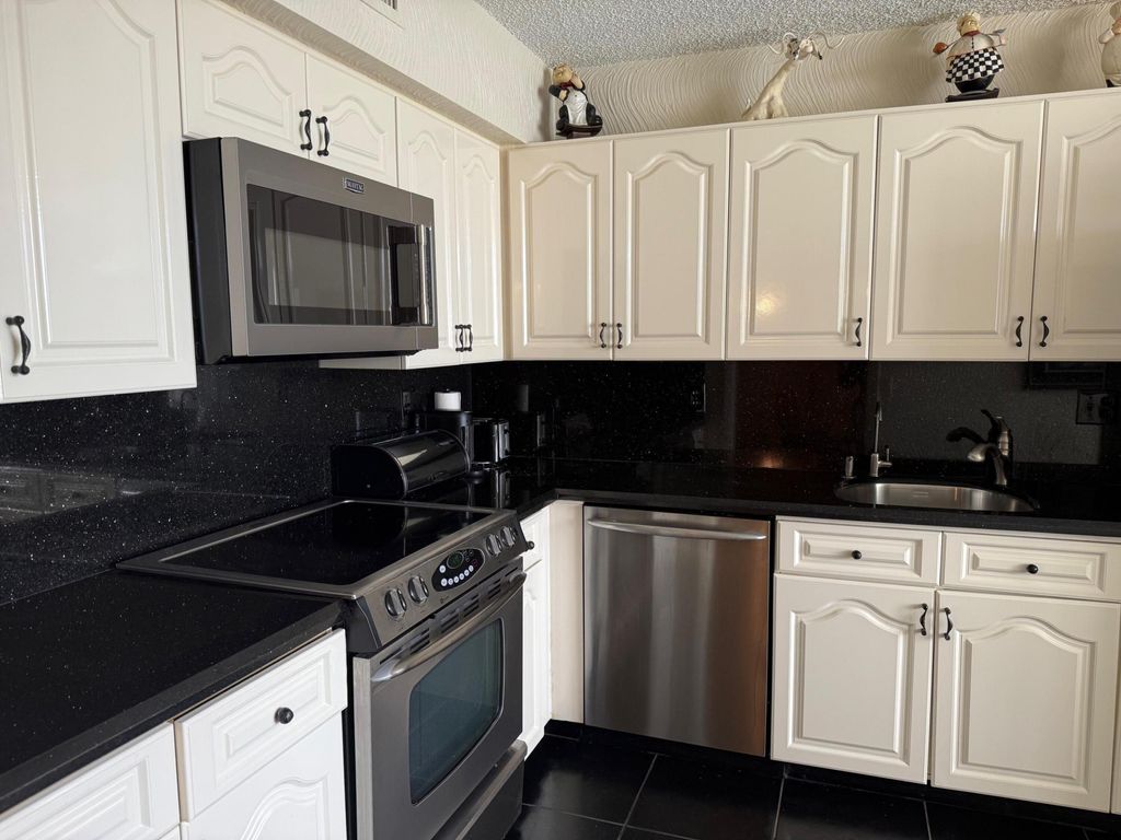 Photo of 7564 Regency Lake Drive #702, Boca Raton, FL 33433 (MLS # R11140044)