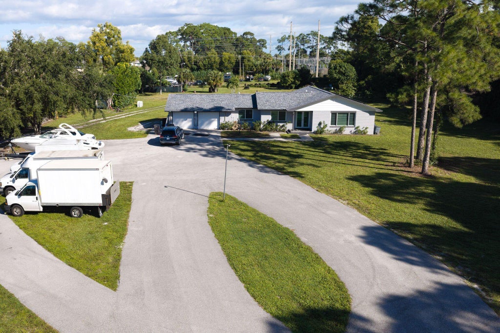 Photo of 6529 Pioneer Road, West Palm Beach, FL 33413 (MLS # B26092710)