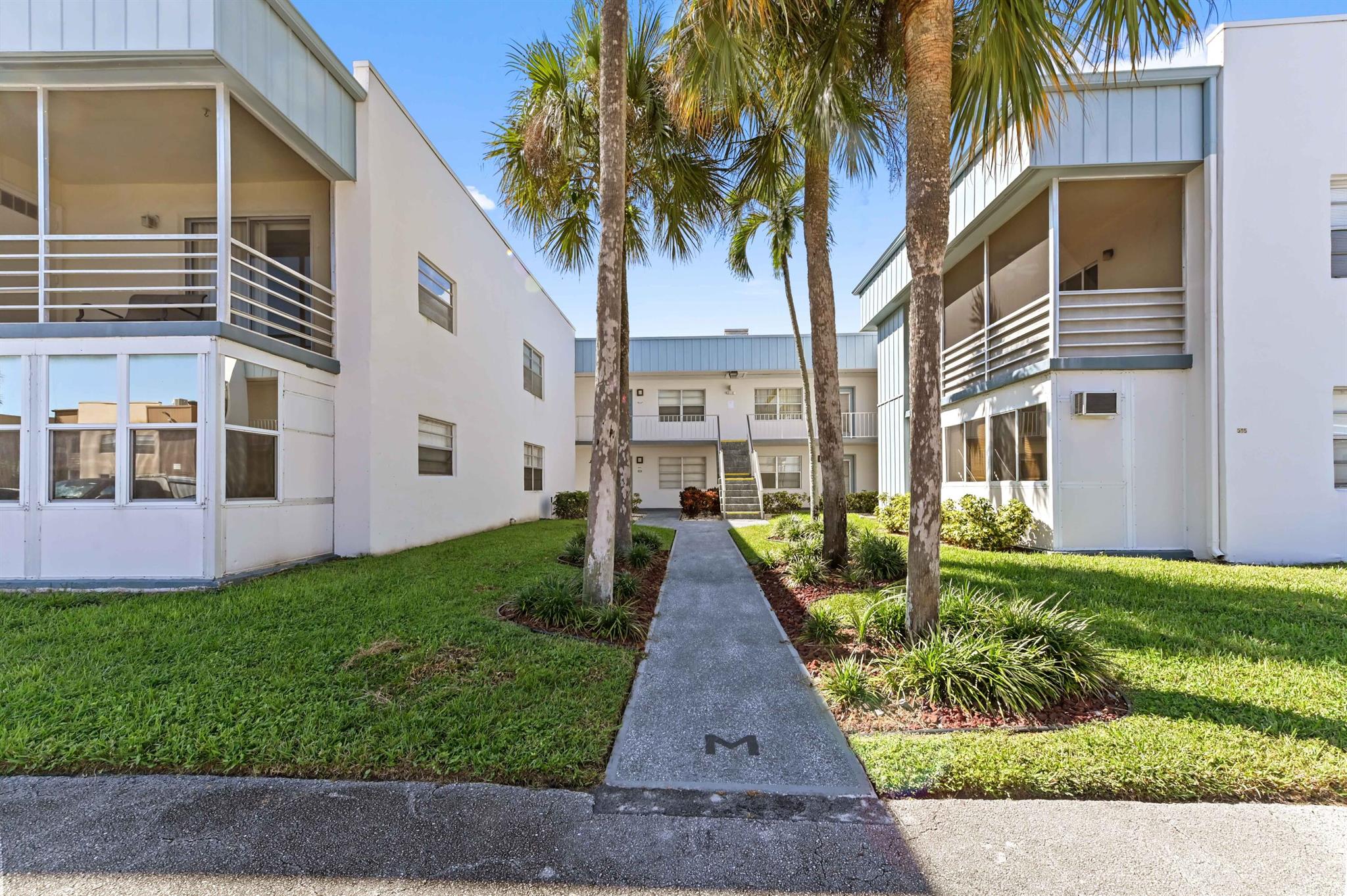 Welcome to 616 Burgundy M, located in the desirable Kings Point 55+ Community in Delray Beach. This charming 1-bedroom, 1.5-bath second-floor unit offers a comfortable and low-maintenance lifestyle in one of South Florida's most active adult communities.The home features a covered and screened patio, perfect for enjoying the Florida weather year-round. The air conditioning unit was recently replaced,  providing added peace of mind. Inside, you'll find a bright and open living space, a functional kitchen, and a convenient half bath for guests.The Kings Point community itself is nothing short of extraordinary. Feel free to test your skills at two 18-hole golf courses, impeccably designed by famed architect Robert Trent Jones, Sr.