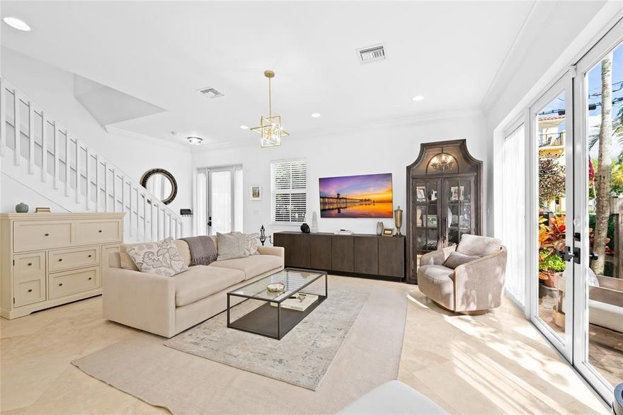 Renovated, stunning townhome nestled in the lively Tarpon River neighborhood with no HOA in the center of Ft. Lauderdale! This beautiful home features 4 spacious bedrooms, 3.5 bathrooms, and a 2-car garage. The main floor features the living and dining areas, while the upper levels provide privacy for all bedrooms. The completely renovated, stylish kitchen includes stainless steel appliances, quartz countertops, and abundant cabinetry. The primary suite showcases a private balcony and an oversized walk-in closet. The 1st floor, stairs, and loft have new high-end flooring. Enjoy the fenced side yard and rooftop terrace. Complete with impact-resistant windows and doors with no HOA fees. Ideally situated minutes from downtown, the beaches, the airport, restaurants, and shops.