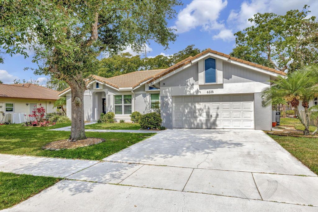 Photo of 6225 NW 45th Terrace, Coconut Creek, FL 33073 (MLS # R10991390)