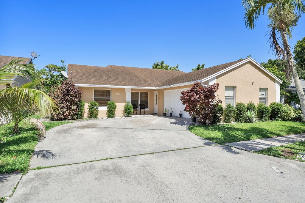 Photo of 5636 Priscilla Lane, Lake Worth, FL 33463 (MLS # B26049235)