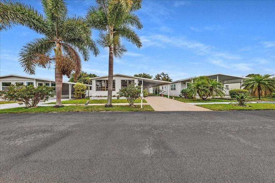 Adult 55+ gated community. Spacious 2-bedroom manufactured home where you own the land—no lot rent! This home offers vaulted ceilings, ceramic tile, an island kitchen, and a large raised enclosed porch. Ready for your personal updates and touches.   Enjoy community amenities including a clubhouse, heated pool, gym, tennis, pickleball, shuffleboard, new putting green, and social activities. Small pet OK. Monthly maintenance is only $128. HOA requires a $600 deposit held for 2 years. No leasing for the first 2 years of ownership.  Conveniently located close to shopping, highways, restaurants, and approximately 15 minutes to the beach. Furnishings included.