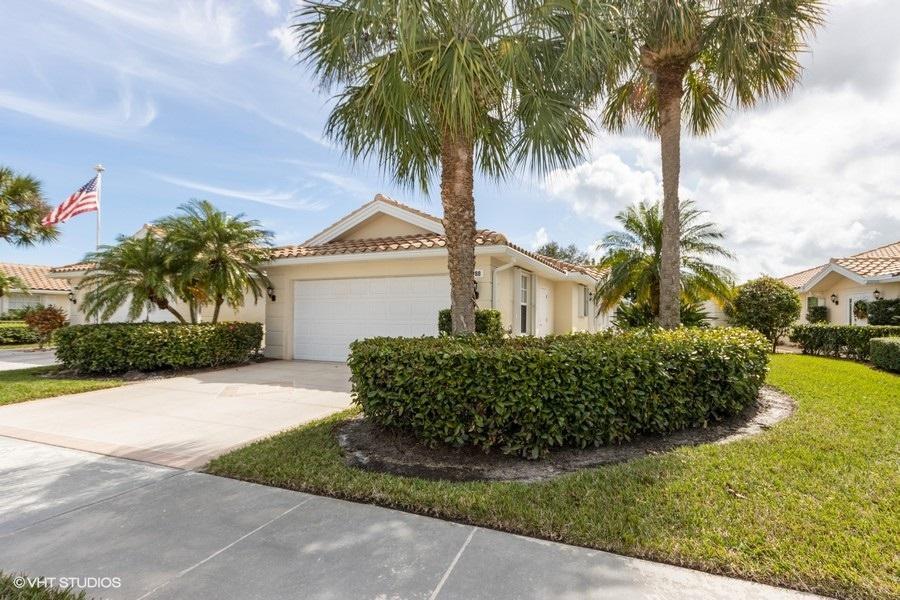 Location, location, this 2 bedroom, 2 bath Villa is ideally located in Lost lake Golf Club gated community. Move-in ready, the home has been freshly painted, new laminate wood floors and has new accordion shutters on all windows and doors. Laundry room with a sink is indoors and there is a garage for 2 cars. Plenty of extra storage with attic space and pull down stairs. The screened in patio overlooking the lake view provides an oasis for peace and tranquility. Very private and great for entertaining. There are two community pools, tennis, state of the art fitness center, media room and beautiful clubhouse. Lost Lake Golf Club is located just minutes from the beautiful sandy beaches of the Atlantic Ocean and downtown Hobe Sound and just fifteen minutes to downtown Stuart.