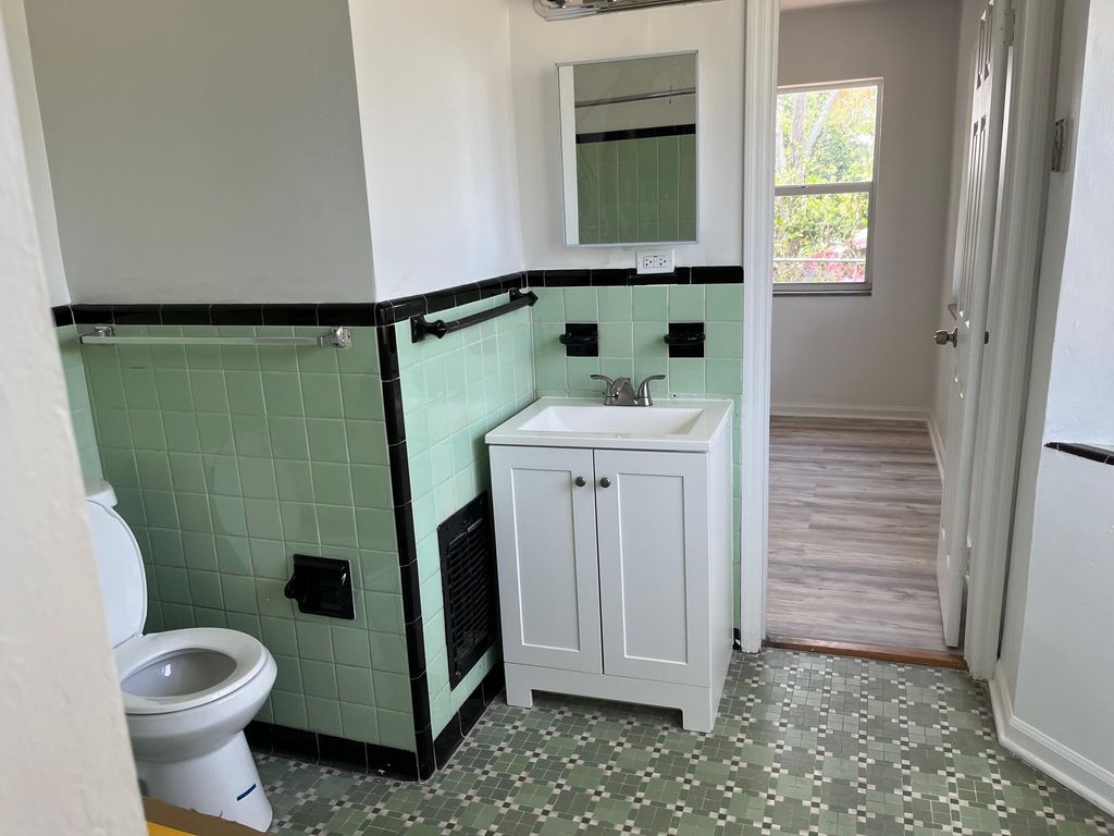 Photo of 205 Date Palm Drive, Lake Park, FL 33403 (MLS # R11029123)