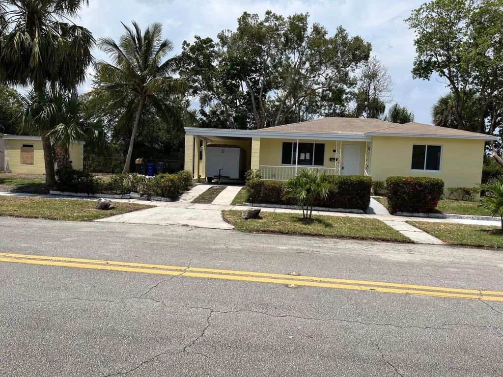 Photo of 205 Date Palm Drive, Lake Park, FL 33403 (MLS # R11029123)