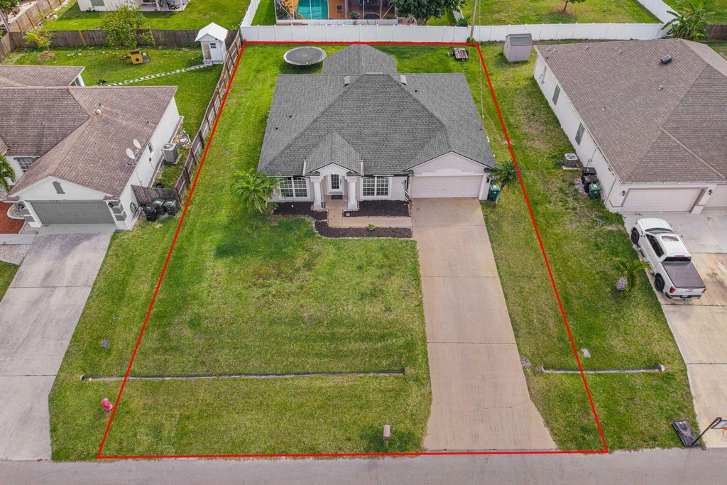 Photo of 1949 SW Logan Street, Port Saint Lucie, FL 34953 (MLS # R11062956)