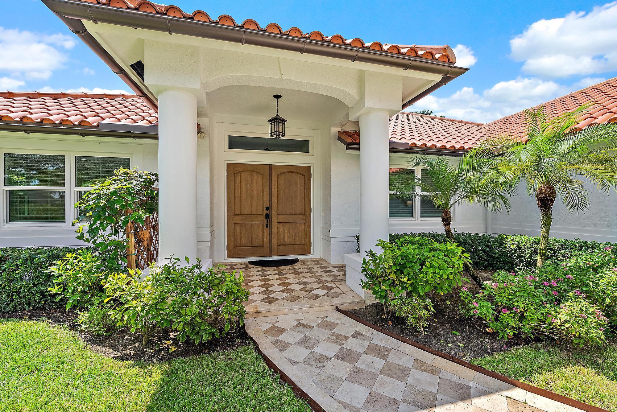 Built in 2001 with solid CBS construction, this home offers quality, comfort, and peace of mind with all the major upgrades already complete. Situated on a large corner lot with a private backyard, it features a 4-bedroom plus den, cathedral ceilings, and a welcoming double-door entry. The spacious kitchen offers abundant storage, stainless steel appliances, granite countertops, a gas range, and water filtration at the sink. All bathrooms are finished with marble countertops, and the primary suite boasts two walk-in closets. Major upgrades include a 2024 A/C with UV system, new roof and gutters (2025), full impact glass windows and doors (2020), tankless water heater (2019), Hunter Douglas plantation shutters, and attic insulation (2019).