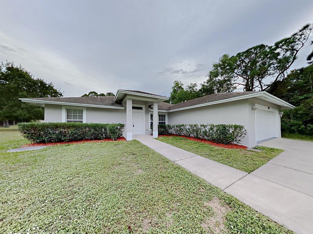 Photo of 1682 SW Boykin Avenue, Port Saint Lucie, FL 34953 (MLS # R11016547)