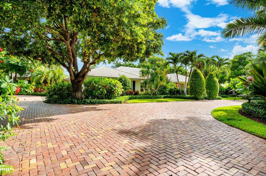 Completely remodeled Gulf Stream residence, on almost an acre of verdantly landscaped grounds, is ideal for family living and gracious entertaining, with a large pool, separate guesthouse and tennis court. The residence features elegant living and dining rooms, a pool-view great room with a fireplace, a gourmet cook-island kitchen, and a pool-view primary suite with a fireplace.