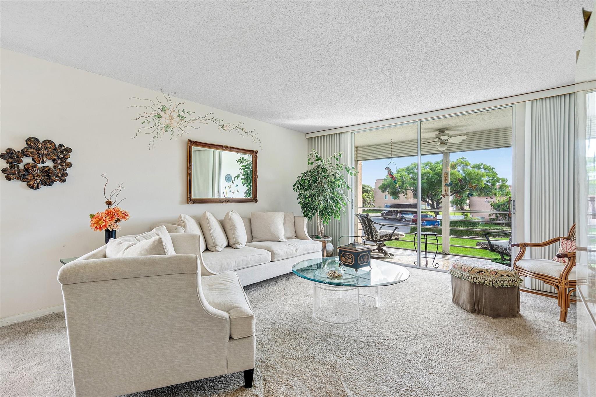 EXCEPTIONAL Value in Sunrise Lakes Phase 4-FREE GOLF Community! Don't miss this rare opportunity to own a bright & spacious 2 bdr 2 ba CORNER UNIT, with a remodeled kitchen in the highly desirable 55+ community known for it's amenities: Pool, Jacuzzi, Sauna, Tennis, Racquetball, Shows, Concerts, Dances +! Enjoy panoramic golf course & pool views from your screened west-facing patio-perfect for soaking in breathtaking sunsets. Extra south facing golf view windows fill the home w/ natural light all day long, creating a warm & inviting atmosphere. Nearly 1,000 sq. ft. of thoughtfully designed living space. This unit offers comfort, style, and security in one of Broward County's safest communities. Short drive to Fort Lauderdale Beach & Sawgrass Mills! Act Fast-this gem won't last long!