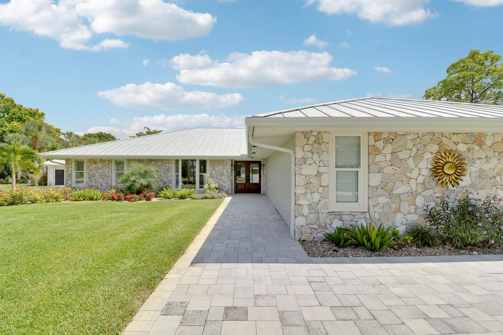 Photo of 386 NE Ficus Terrace, Jensen Beach, FL 34957 (MLS # R11094962)