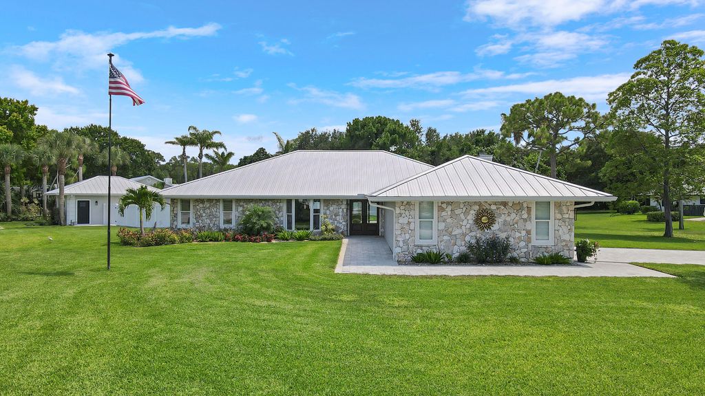 Photo of 386 NE Ficus Terrace, Jensen Beach, FL 34957 (MLS # R11094962)