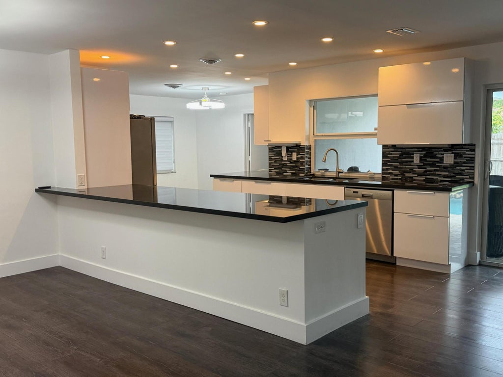 Photo of 1961 NW 43rd Court, Oakland Park, FL 33309 (MLS # B26046573)