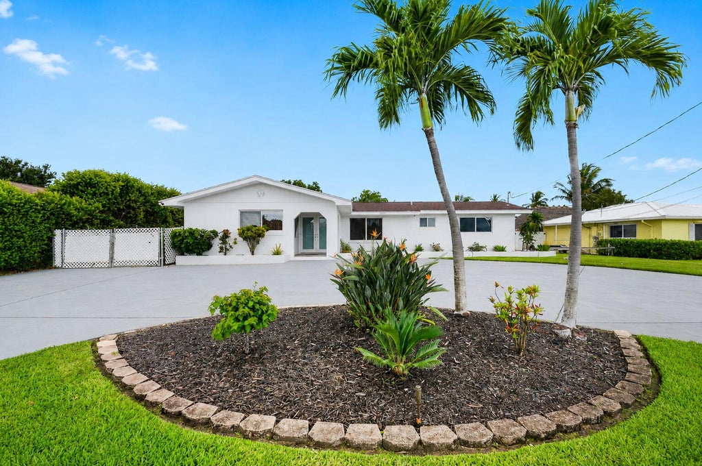 Photo of 7951 W Lake Drive, Lake Clarke Shores, FL 33406 (MLS # B26051620)