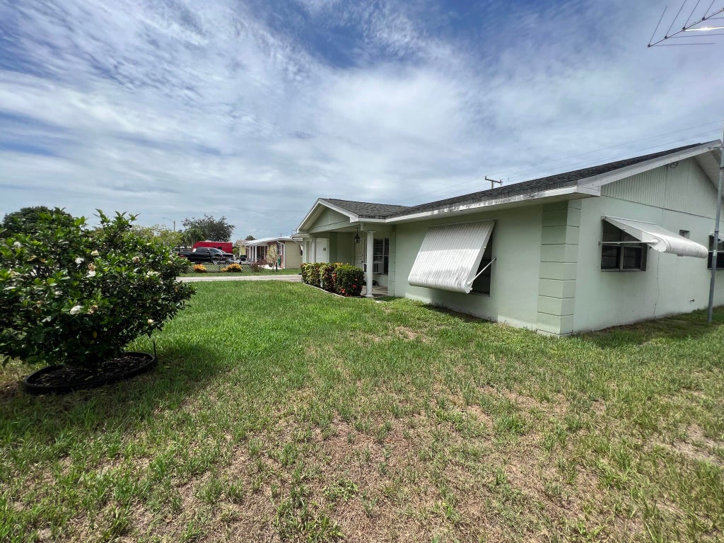 Photo of 213 E Arbor Avenue, Port Saint Lucie, FL 34952 (MLS # R11001622)