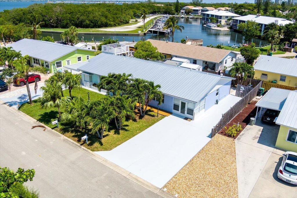 Photo of 71 S Las Olas Drive, Jensen Beach, FL 34957 (MLS # R11089561)