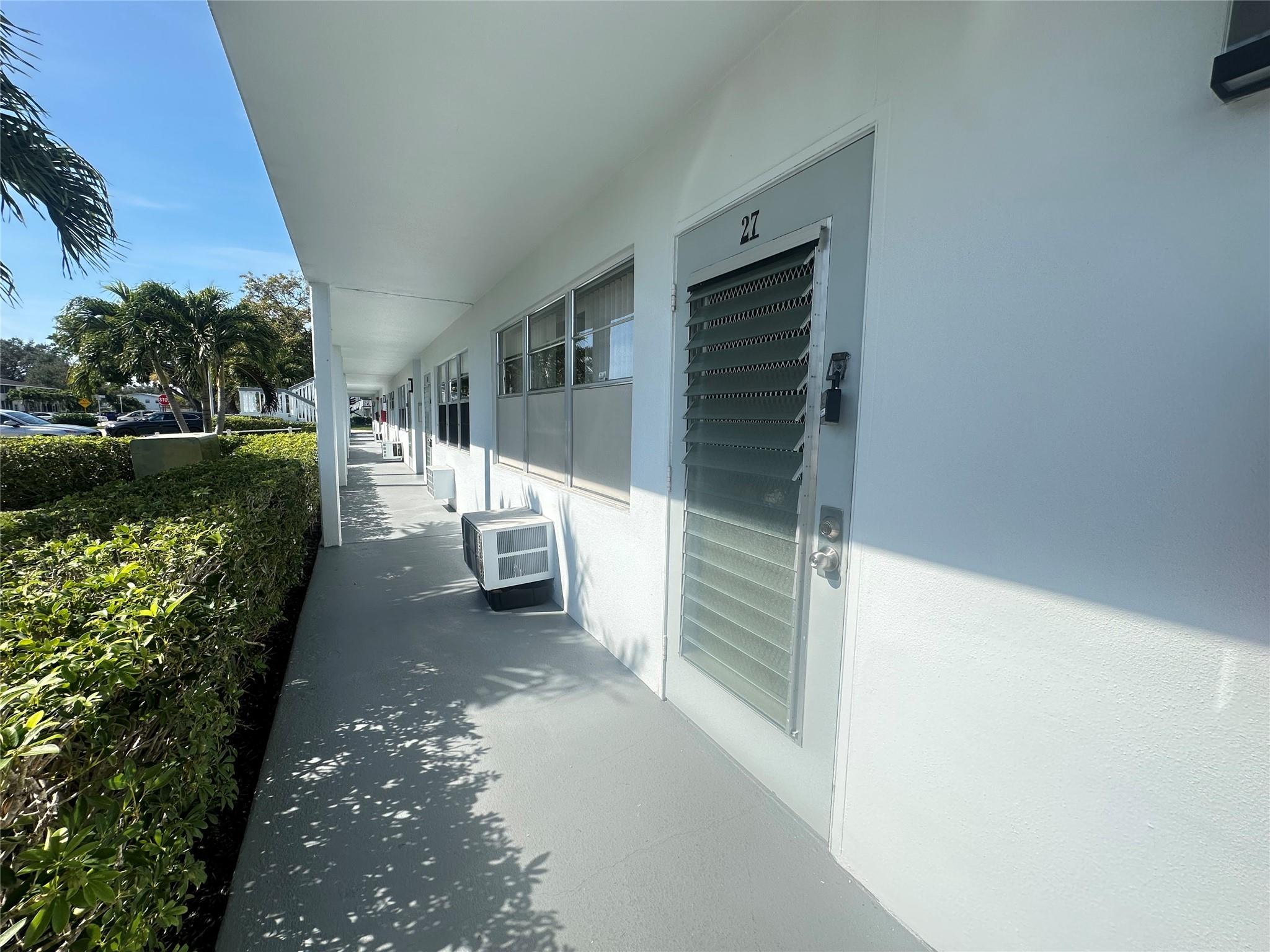 This bright 1st flr 1 bedrm, 1.5 bath condo is in a RENTABLE BLDG, PRICED TO SELL & waiting JUST FOR YOU! Offering a perfect blend of comfort & convenience, pkg is in front & it comes fully furnished & equipped! The open kit & lg. ceramic tile thru-out give you that spacious feeling! Updated bathrms w/a barn door that modernizes the primary, freshly painted & 2 W/W AC units more wonderful upgrades! The screened patio has roll up shutters, extra storage closet & exit door to enjoy the serene garden view! Enjoy the active adult lifestyle w/24 hr sec, free bus service, pools, tennis, putting green, pickleball, shuffleboard, Clubhouse w/gym, movies, theater, indr/outdr pools, cafe, classes, billiards & more! Close to West gate, shopping, restaurants & just min to the beach! Assoc. Claims 55+