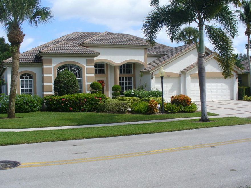 This classic Arthur Rutenberg pool home sits in the heart of Jupiter in one of the most sought after communities called The Moorings of Jupiter. This Riviera model was built with style, having 4 bedrooms plus Office/Den/Nursery, 3 full baths and a 3 car garage. Beauty starts immediately upon entry through the double glass front doors which lead right into the front foyer. The spacious living and dining rooms areas are complete with Tray Ceilings and Crown Moldings. This entertaining home is move-in ready, freshly painted inside and out as well as brand new Berber carpeting in all the bedrooms. The large kitchen which flows onto the huge great room with gas fireplace has 42 in cabinetry accented by Corian countertops and stainless steel appliances (range is plumbed for gas). More... This very sought after split floor plan offers views of the screened in pool area from the kitchen, family room, dining room, and master suite. Additional features include: Vaulted Ceilings, Formal Living & Dining Room, Breakfast Nook, Gas Fireplace, Master Sitting Area, His & Hers Full Size Walk-In Closets, Separate Laundry Room with Laundry Sink & New Washer & Dryer, Covered Patio with Gas Hook-up for Grilling, New Colorful Pool Light, Hurricane Shutters, Barrel Tile Roof, CBS Construction, Tropical Landscaping with Huge Side Yards, Martin County Taxes and Schools, Low HOA Fees.