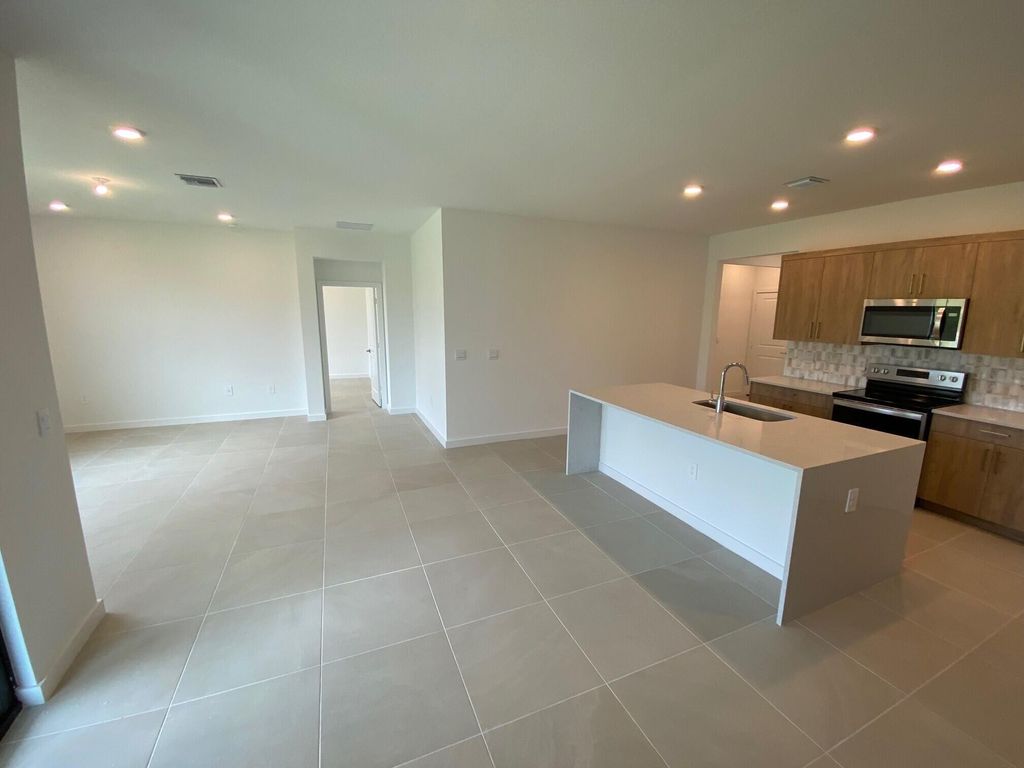 Photo of 1935 NE Ocean Dunes Drive, Jensen Beach, FL 34957 (MLS # R10913942)