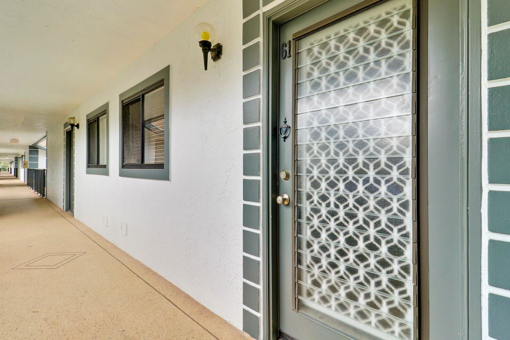 Photo of 15364 Lakes Of Delray Boulevard #61, Delray Beach, FL 33484 (MLS # R11154893)