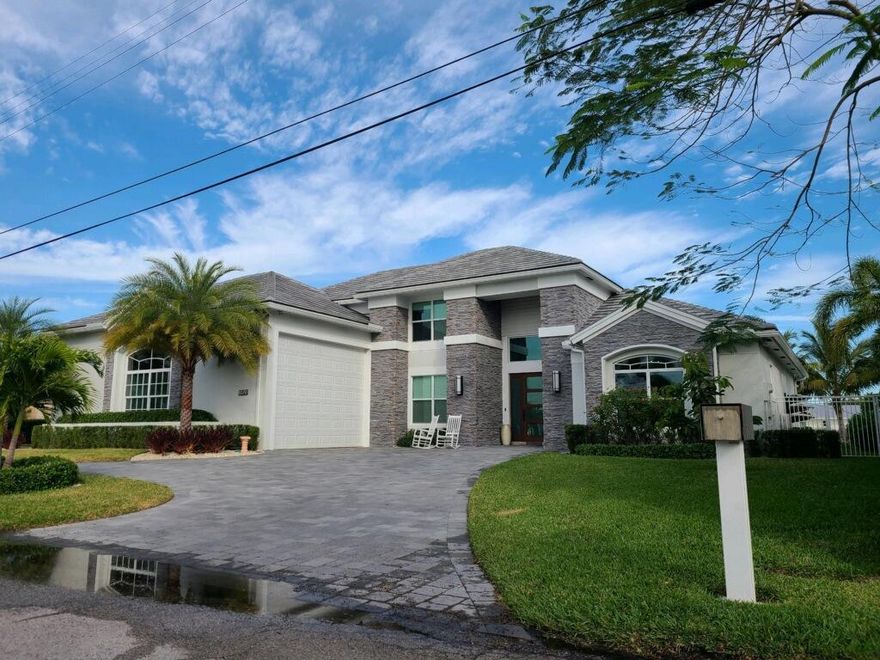 This spectacularly remodeled waterfront home with guest apartment  features 100 feet of deep water frontage with an 80 foot dock and 20,000 pound boat lift. The interior of the home boasts high ceilings throughout, with an open concept and all the upgrades one could wish for.