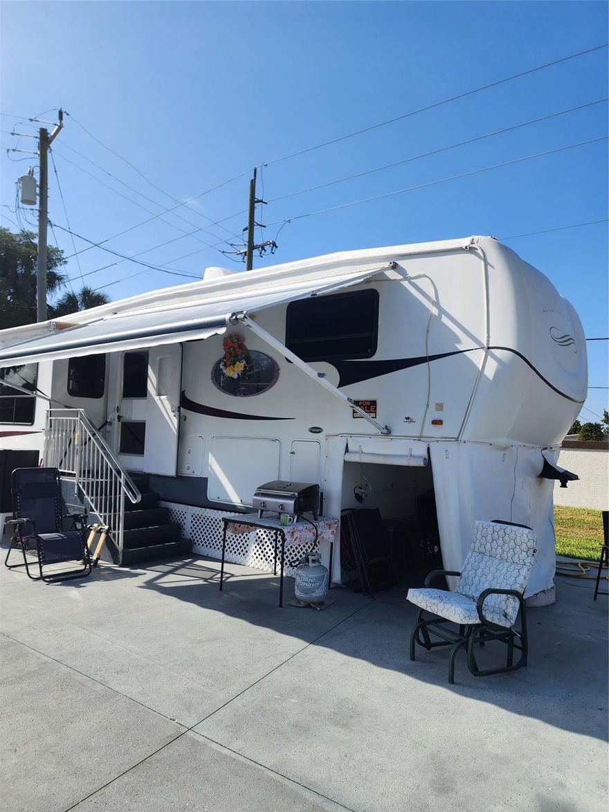 In Ancient Oaks with a 2005 Heartland Landmark fifth wheel with 3 slide outs and a storage shed. Located on a 1
 way street, with hurricane tie downs, skirting, water/sewer hook ups. This well cared for home boasts leather
 lounger chairs, sofa sleeper couch, TV, dining room table & chairs , Front queen size bedroom with closet and a safe,
 plenty of storage & Splenda W/D combo in a closet. A full size shower. Many Cupboards, cabinets, drawers for
 storage. Includes fully equipped Kitchen. There are 2 AC units, 1 is new and the unit cools well. The roof was
 painted this year and has been sealed. There is a large basement storage. Even comes with a Cuisinart Gas Grill, His
 & Her bicycles, small outside refrigerator and is *Move in Ready*