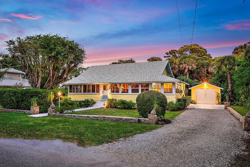 Discover a rare opportunity in one of Hobe Sound's most sought-after hidden enclaves. Located east of Gomez Avenue and south of Bridge Road in Old Hobe Sound, this private .25 acre property offers a tranquil setting with exceptional flexibility. Enjoy the existing home built in 1920 or utilize the expansive, private lot to design and build your custom residence. Residents enjoy access to a private neighborhood boat ramp just down the street and are within walking distance of the fishing pier at Greenfield Park.  Ideally situated just 1.2 miles from Hobe Sound Beach, approximately nine miles south of Jupiter Inlet, and nine miles north of the St. Lucie Inlet, this location provides convenient access to beaches and boating. Built in 1920 using rare Miami-Dade pine, this distinctive three-bedroom, two-bath residence with a detached garage showcases enduring character and exceptional craftsmanship. This Henry Morrison Flagler house was built to accommodate his staff. As noted in historical publications, this home is one-of-a-kind and a must-see!