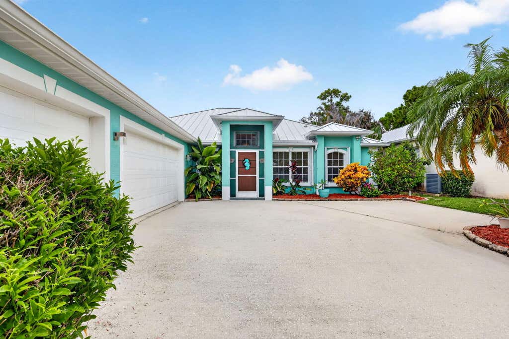 Photo of 482 NW Sunflower Place, Jensen Beach, FL 34957 (MLS # B26058211)