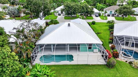 Photo of 482 NW Sunflower Place, Jensen Beach, FL 34957 (MLS # B26058211)