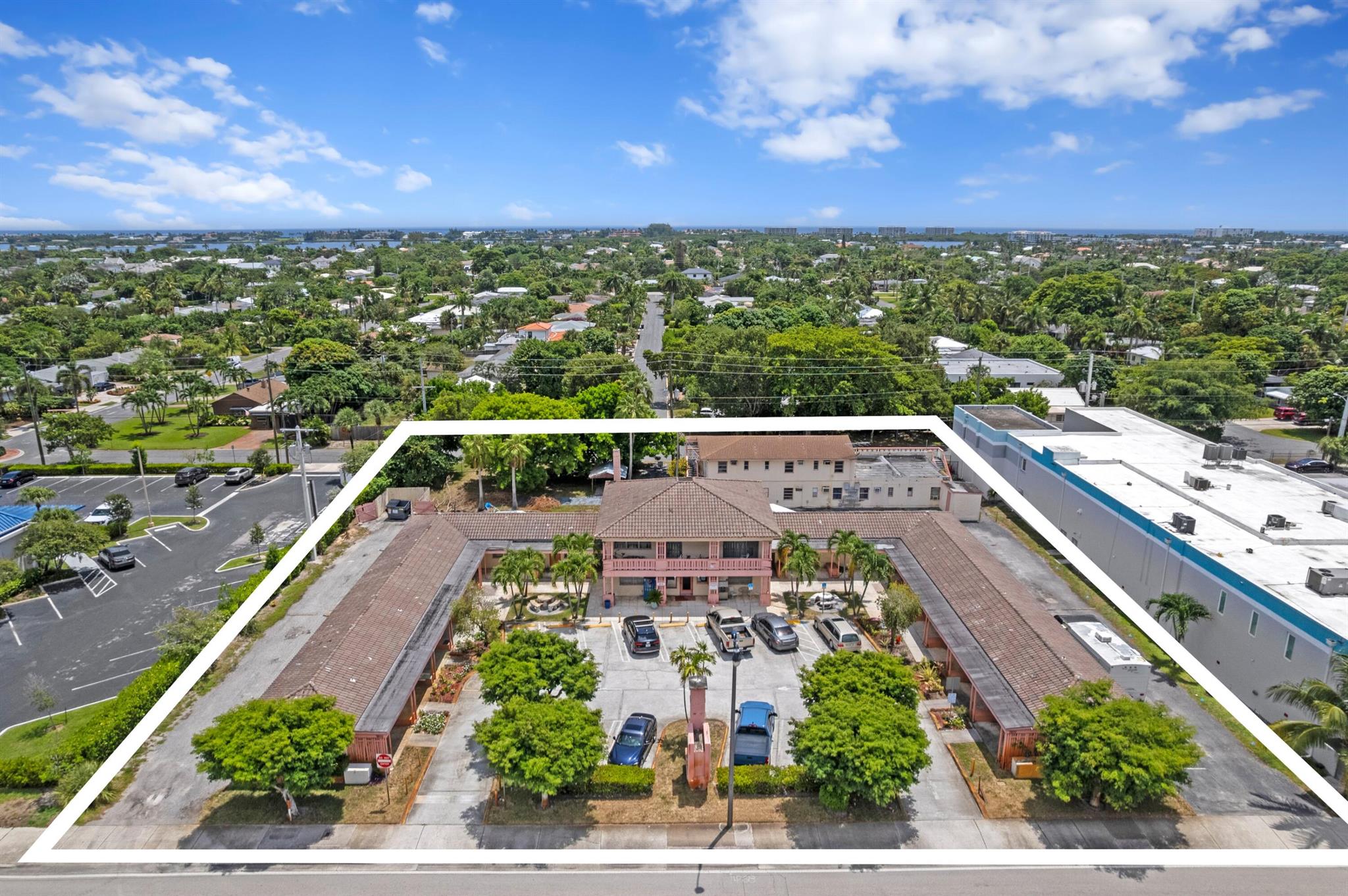 Unlock the full potential of this rare and expansive 1-acre property located in the heart of the rapidly growing SoSo neighborhood along highly visible Dixie Highway. With 28 existing rooms across 4 income-generating structures totaling 10,883 SF under air, this property presents an exceptional opportunity to restore, redevelop, or reposition in one of West Palm Beach's most active commercial corridors.Zoning: Neighborhood Commercial - offering flexibility for hospitality, mixed-use, or commercial redevelopment. Lot Size: Largest hospitality parcel in the south end at 1 acre. Room Count: 28 rooms currently, with potential for expansion up to 32. Structures: 4 buildings onsite - allowing phased redevelopment while maintaining revenue from existing units.