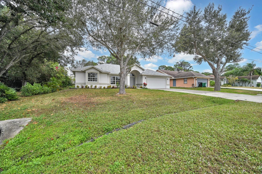 Photo of 2901 SW Collings Drive, Port Saint Lucie, FL 34953 (MLS # R11157784)