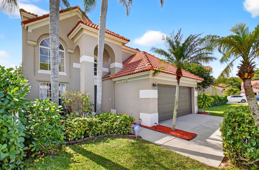 Stunning 3 bedroom, 2.5 bath home located in the prestigious community of Villaggio. Open floor plan is perfect for entertaining. Updated formal living room, dining room, family room and a patio. Gourmet chef's kitchen includes under cabinet lighting, cabinets with pull-outs, granite counter tops, tiled back splash and stainless steel appliances. Luxurious primary suite features a vaulted ceiling, a large walk-in closet, dual sinks, soaking tub & a walk in shower. Other features include neutral flooring, smooth walls, LED lighting, impact glass windows & an abundance of natural light. Enjoy the Florida lifestyle on the patio, large private yard with lush tropical landscaping & a peaceful  lake view. Fenced In Backyard. Located close to shopping, dining & major highways.  A rated schools,